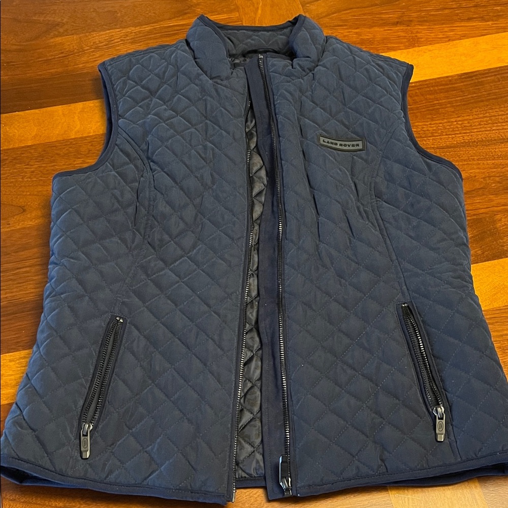Land Rover blue quilted vest, new, fits small USA woman